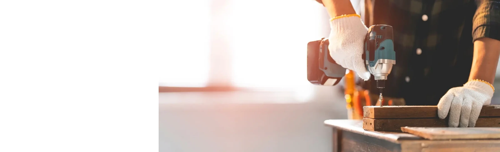 Local handyman repairing a kitchen cabinet